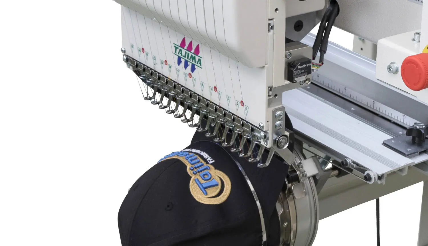 A machine that is working on some kind of hat.